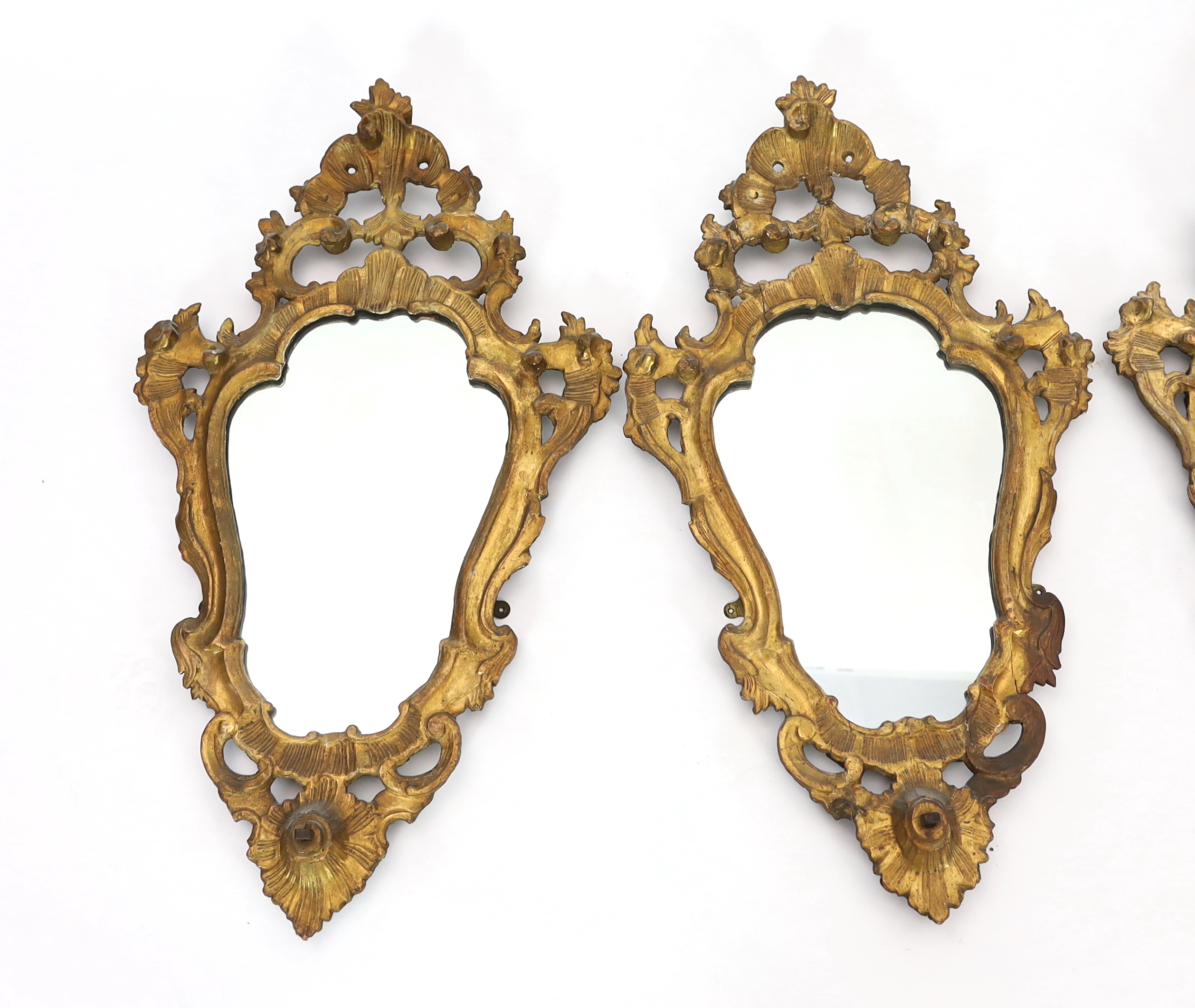 A set of four 19th century Italian giltwood wall mirrors 48cm wide, 83cm high